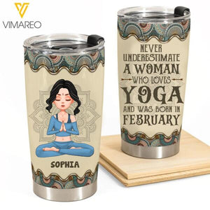 PERSONALIZED NEVER UNDERESTIMATE A WOMAN WHO LOVES YOGA AND WAS BORN IN FEBRUARY TUMBLER TNTQ0902